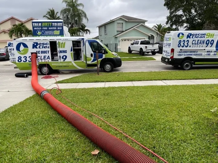 Rescue Clean 911 service vans staged outside the company facility